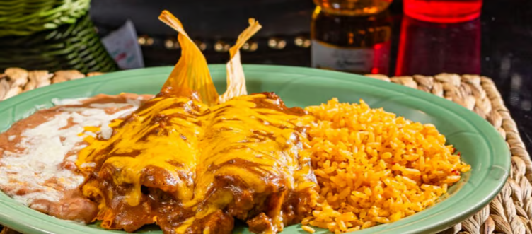 17. Two Tamales Covered with Chili Meat