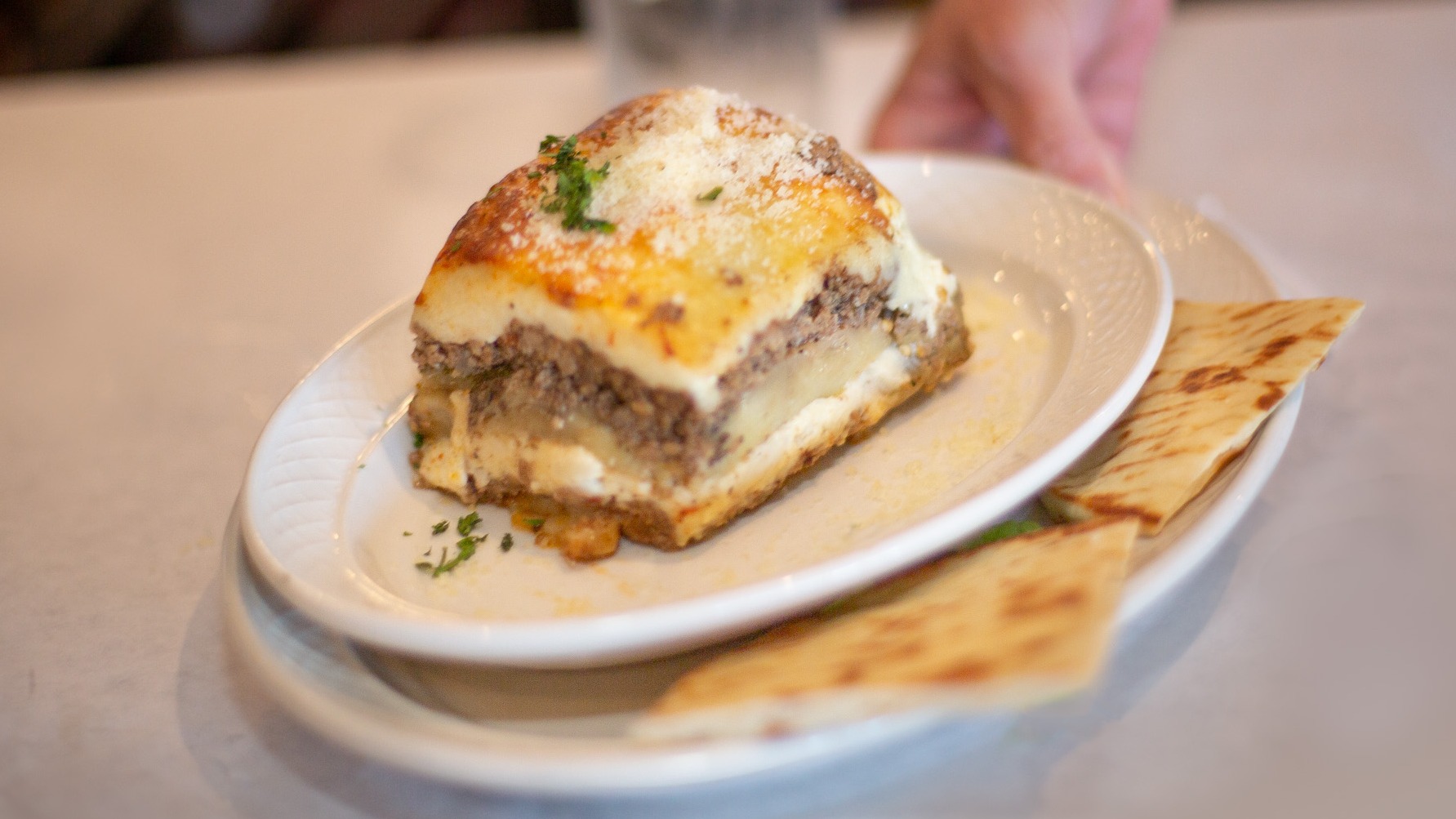 Moussaka with Small Caesar Salad and Pita Bread