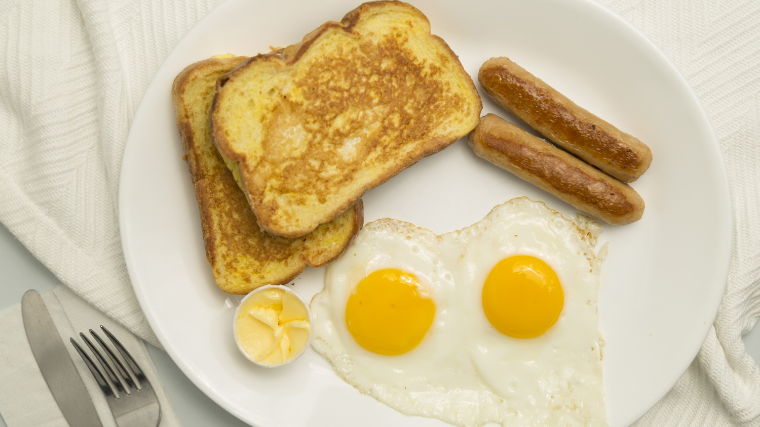 2 French Toasts, 2 Eggs, 2 Sausages