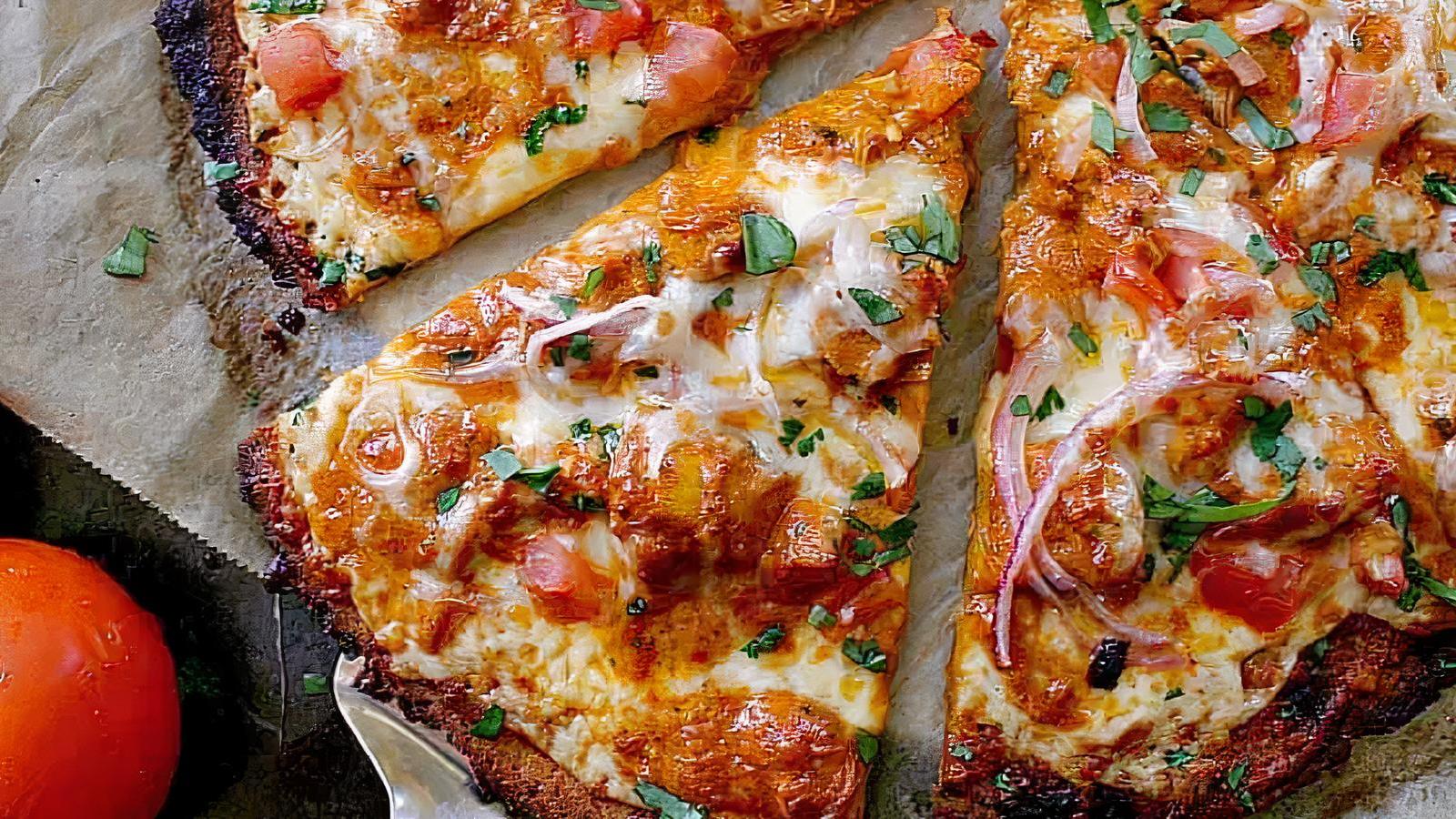 NEW BUTTER CHICKEN PIZZA