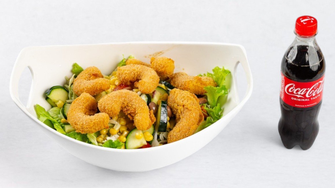 Salad plate with fried shrimp tails and Coca-Cola 0.5 l