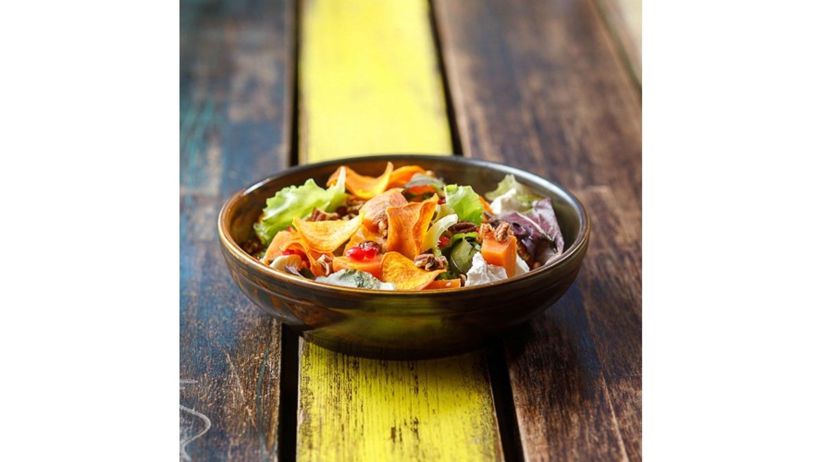 Goat cheese salad with sweet potatoes, nuts and pomegranate