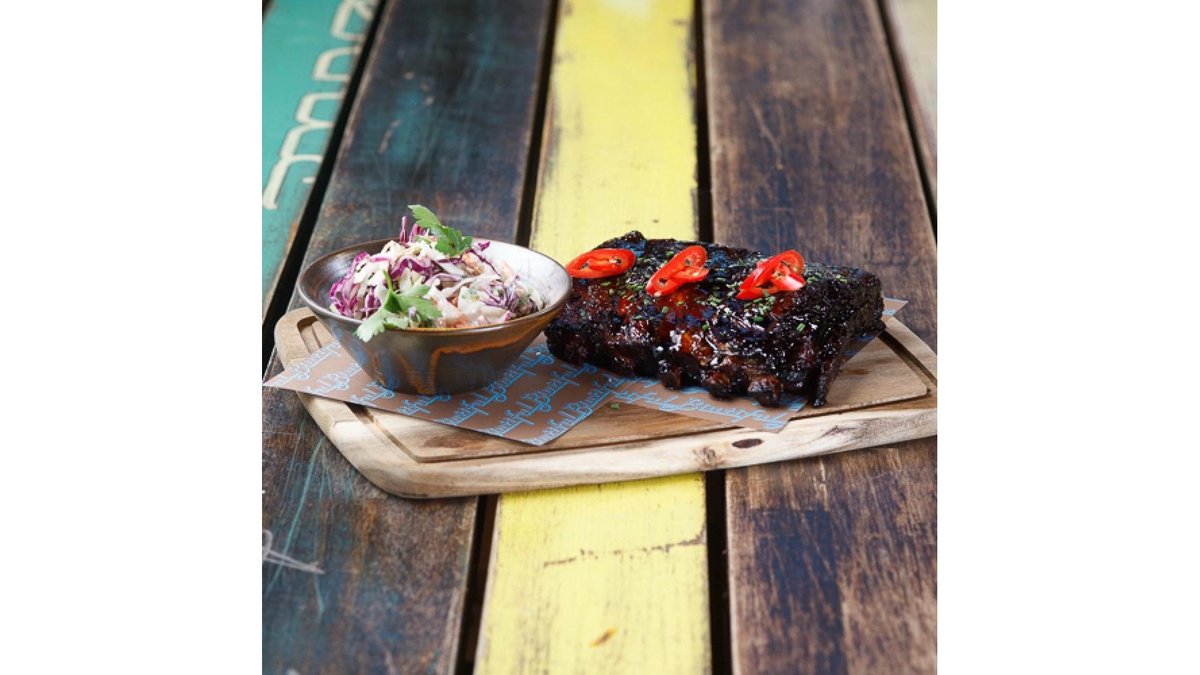 Huge rack of ribs with a light coleslaw salad