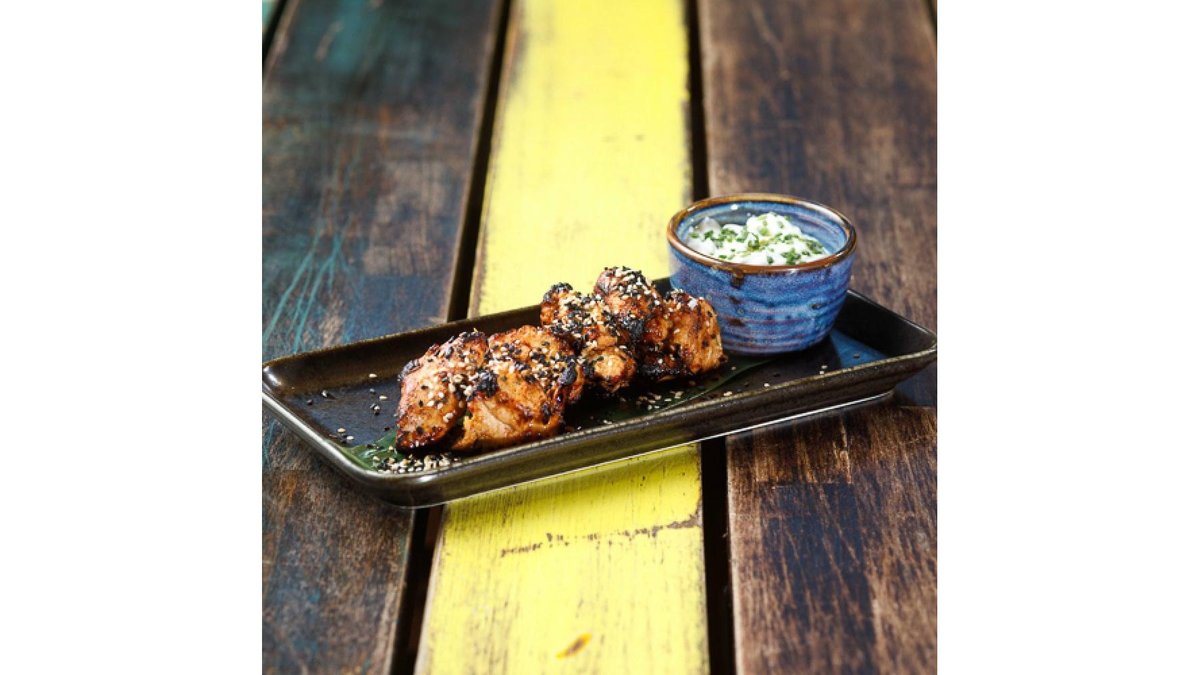Tandoori herb marinated turkey breast on skewers with tzatziki