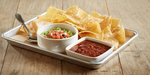 Individually Packaged Chips and Housemade Guacamole + Salsa