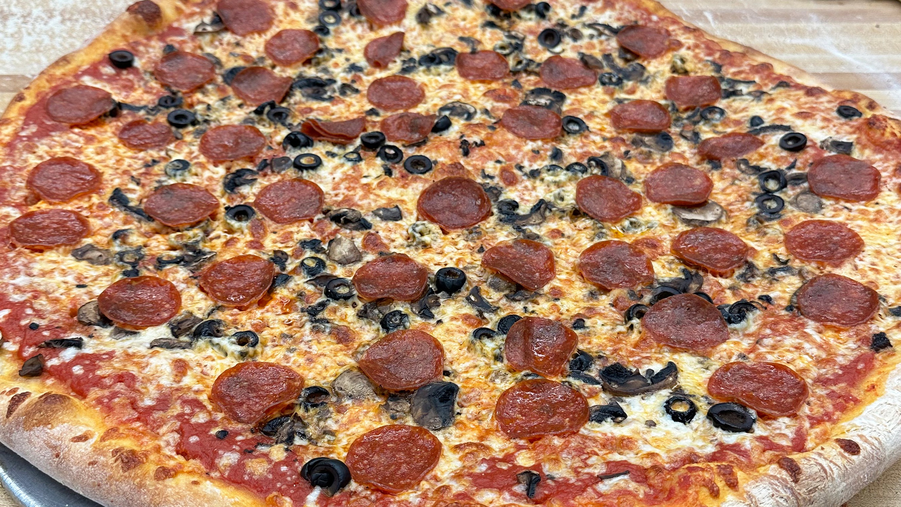 Pepperoni, Mushroom and Olive Pizza