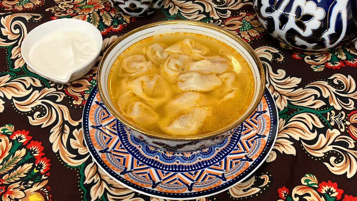 Dumplings soup with beef and cream