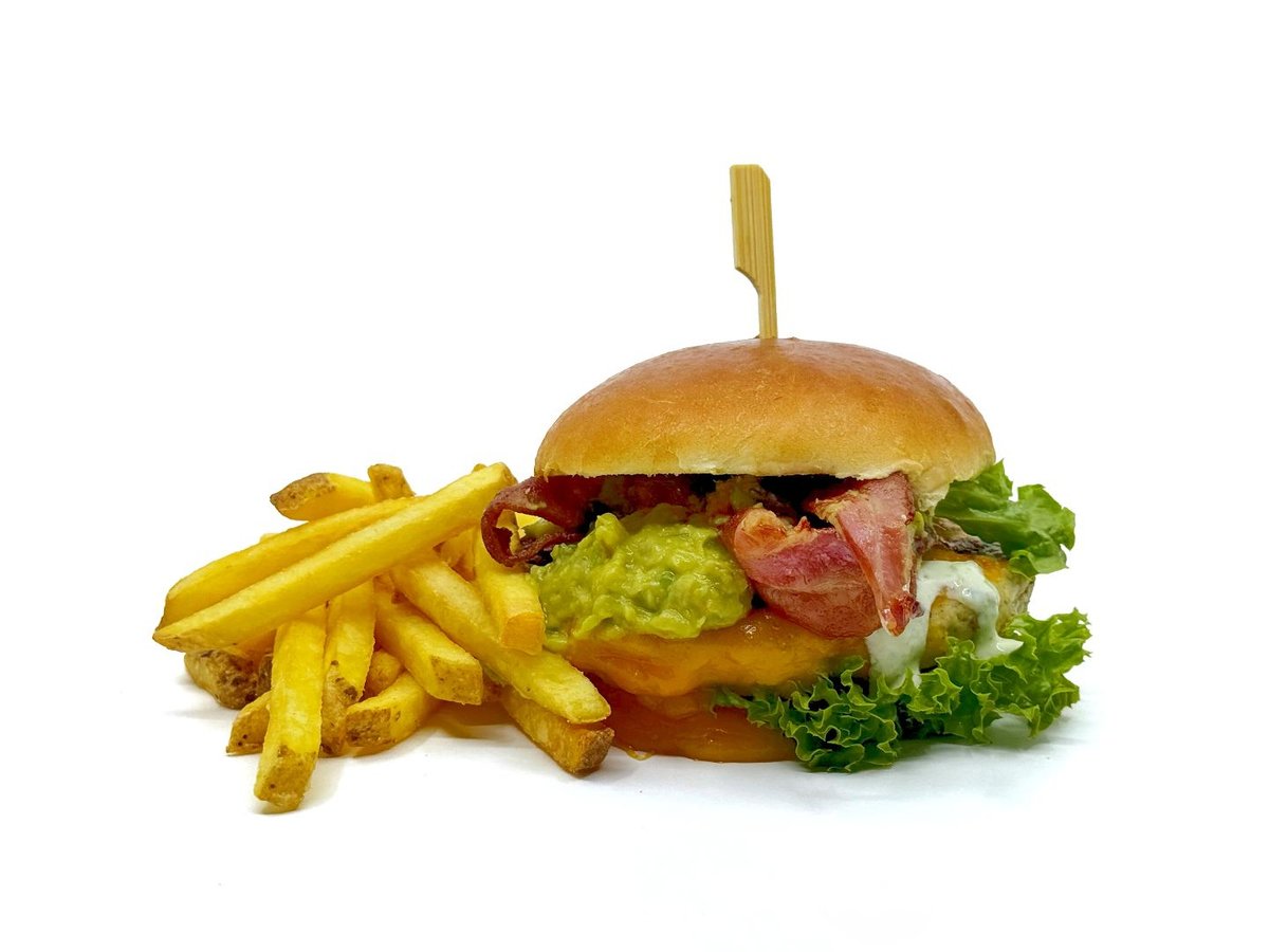 Chicken burger with cheese, bacon, guacamole and French fries