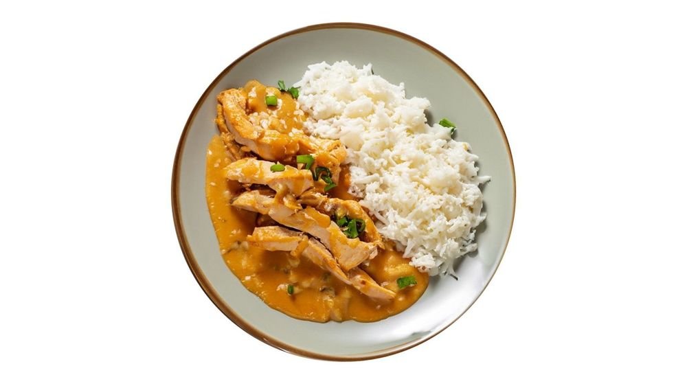 Hähnchenbruststreifen in Rahmsauce mit Beilage