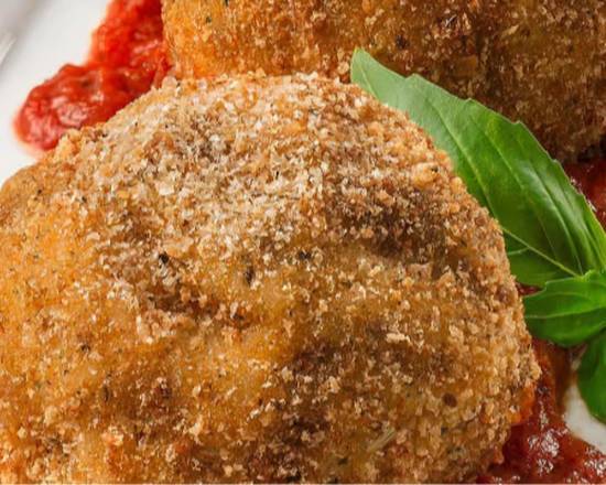 Arancini (rice balls filled with cheese and ragu)