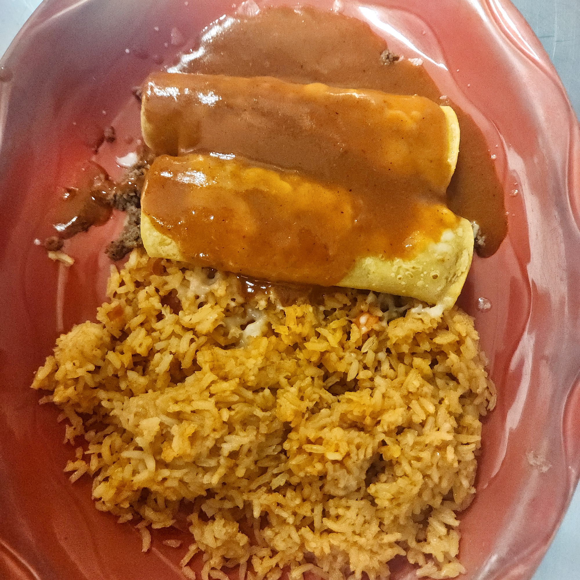 1. One Taco, Two Enchiladas and Choice of Rice or Beans.