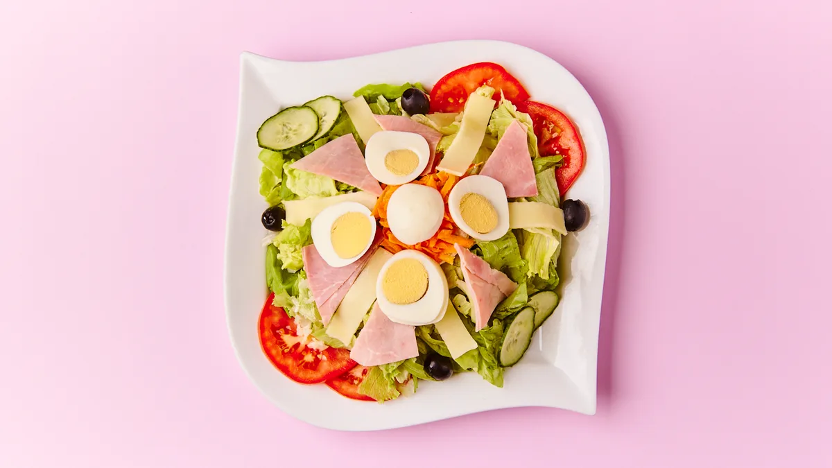 Big Salad with Cheese, Ham, Egg and Olives