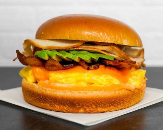 Brioche, Bacon, Turkey, Avocado, Egg, and Cheddar