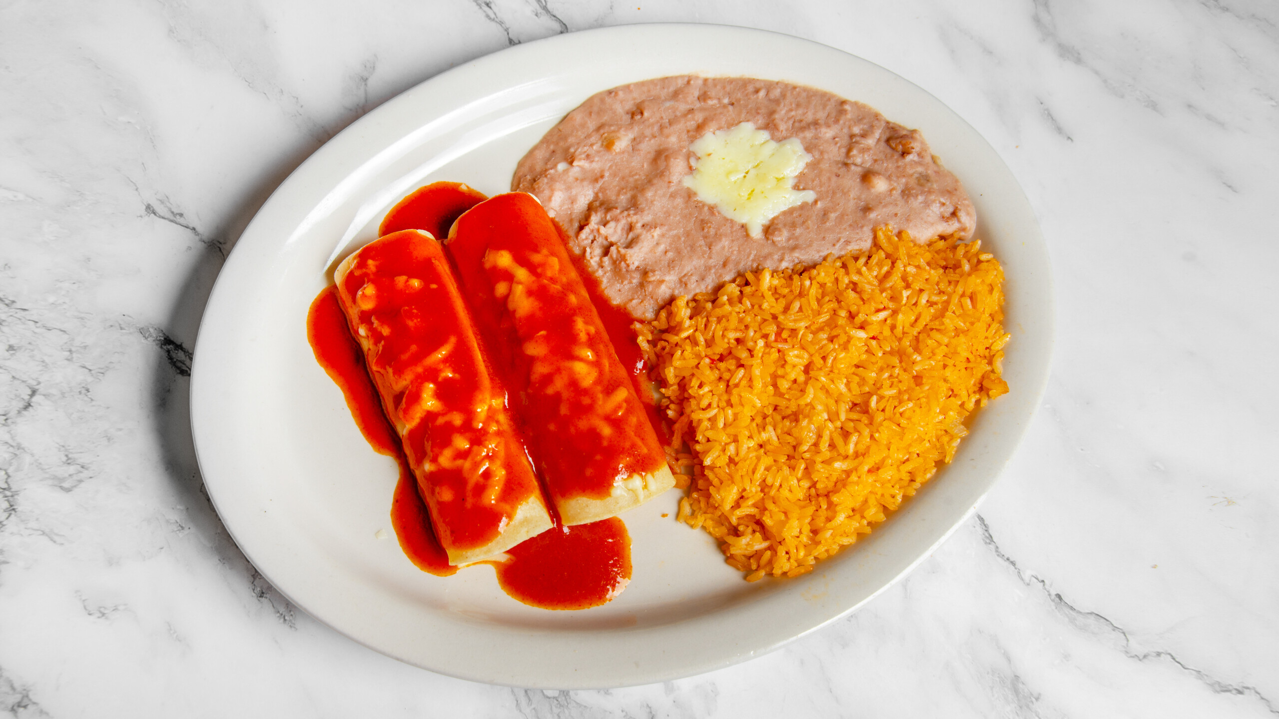 3. One beef, One cheese enchilada with rice and beans