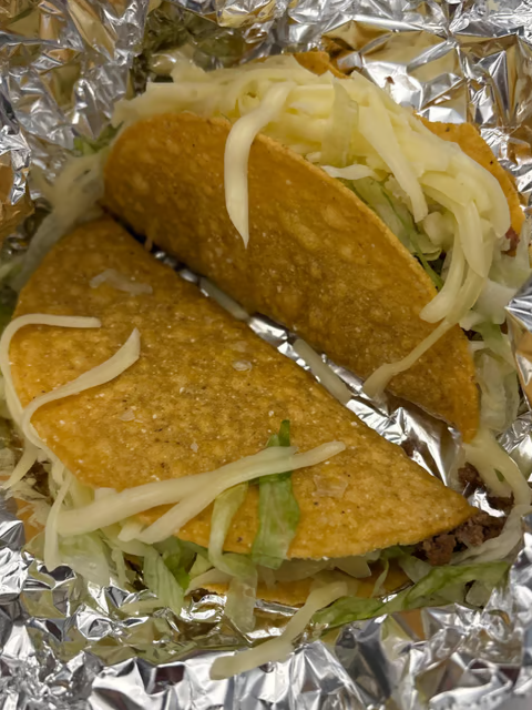 10. Two Beef Tacos, Rice and Refried Beans