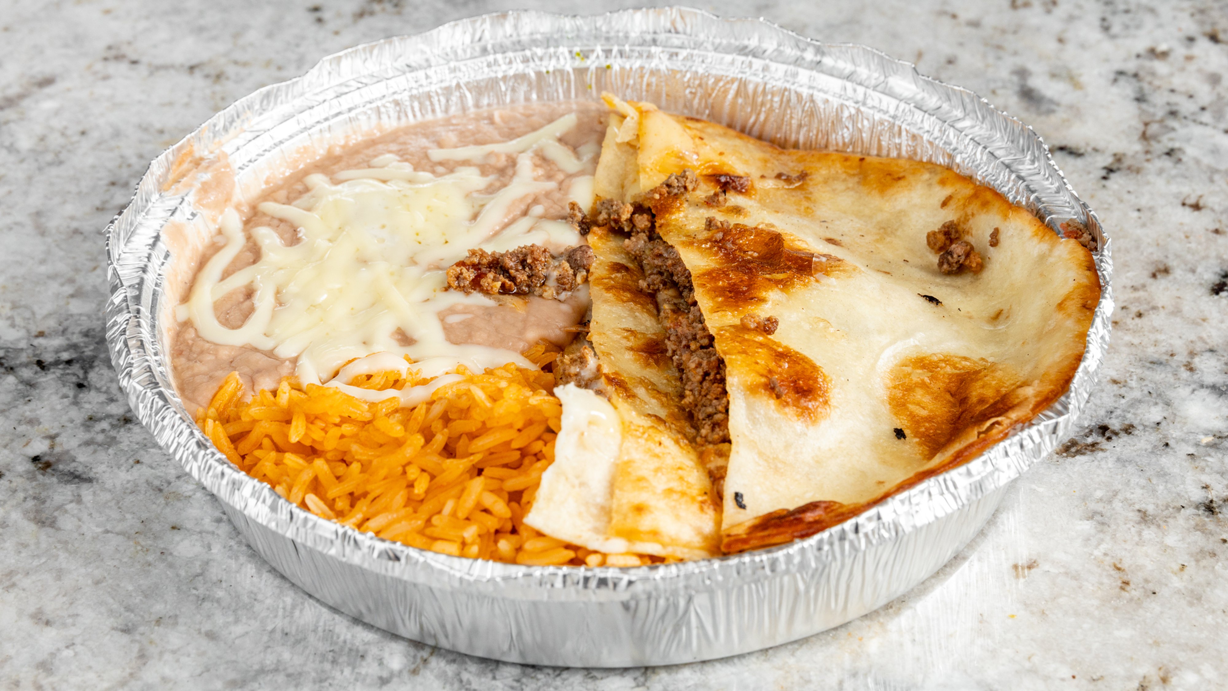 17. One Taco, One Beef Quesadilla, Rice and Beans