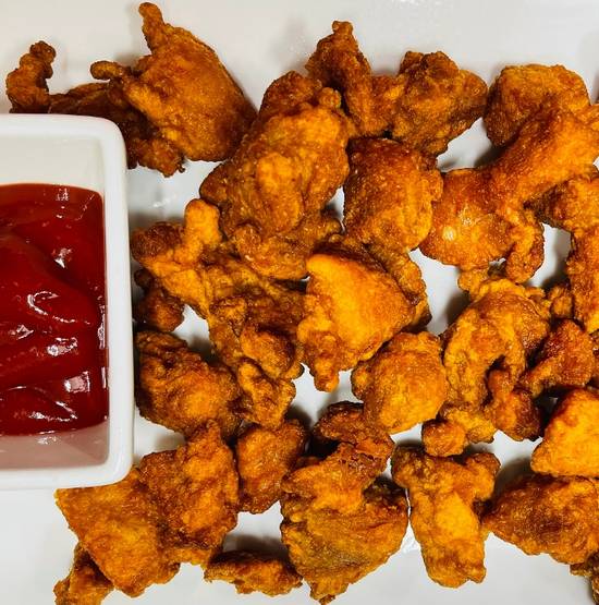 Popcorn Chicken served with ketchup