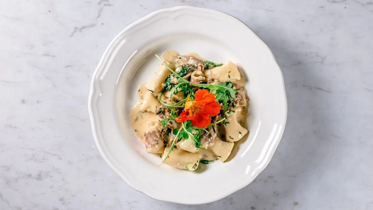 Delicious gnocchi with baked prosciutto and fresh rocket sauce