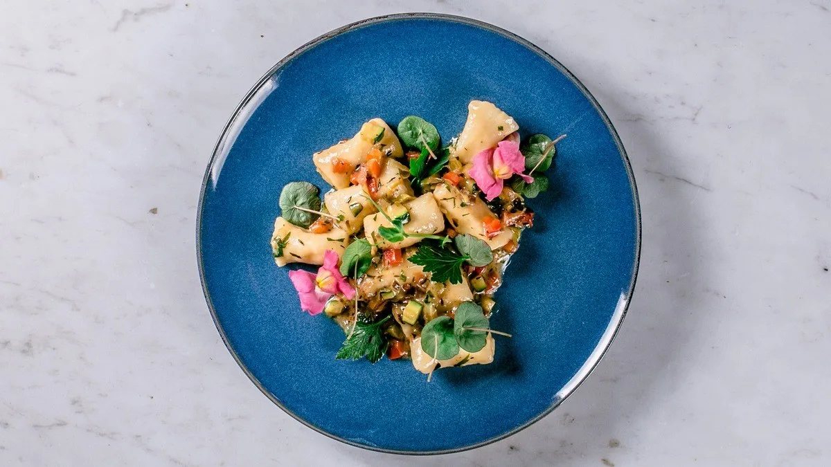 Delicious gnocchi with vegetables and herbs sauce
