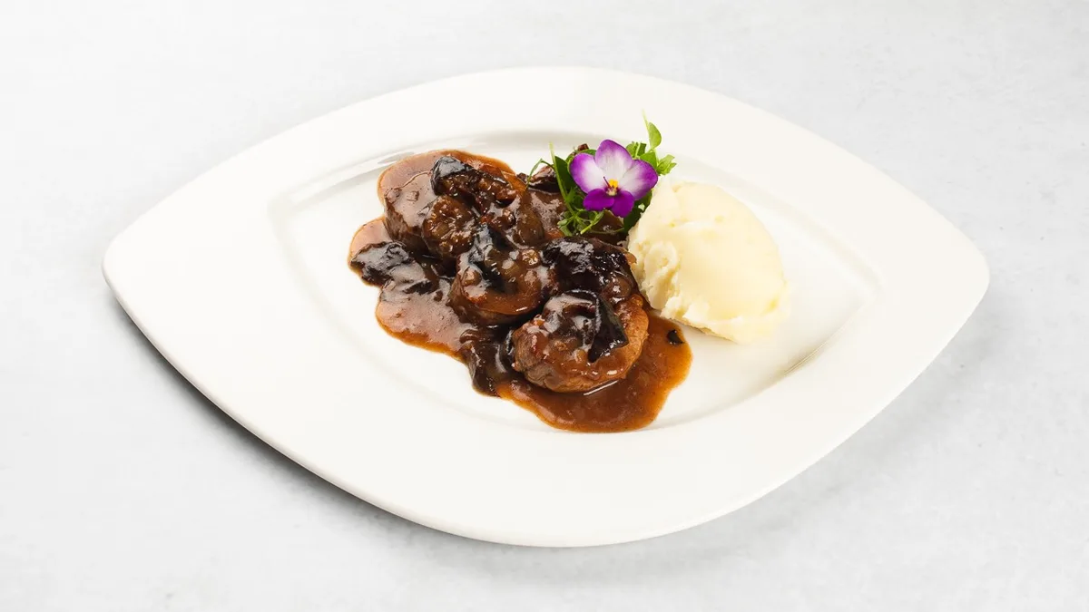 Pork tenderloin in plum sauce and celery mashed potato