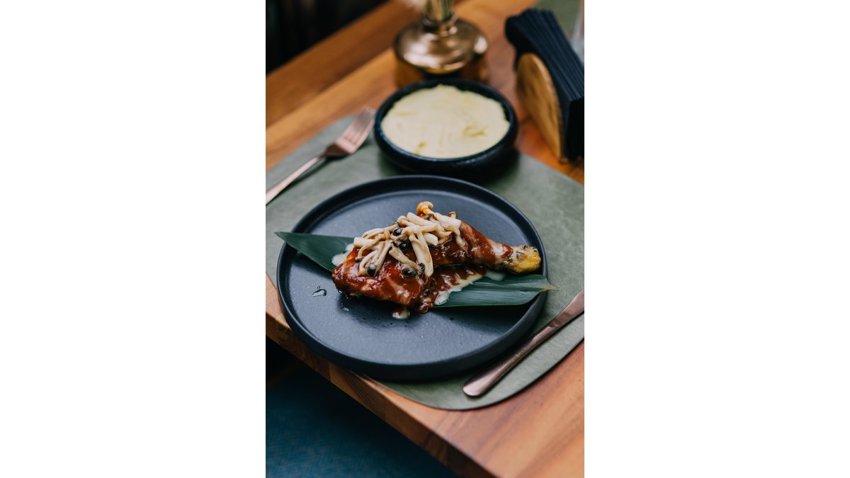 Juicy chicken thighs served with potato puree