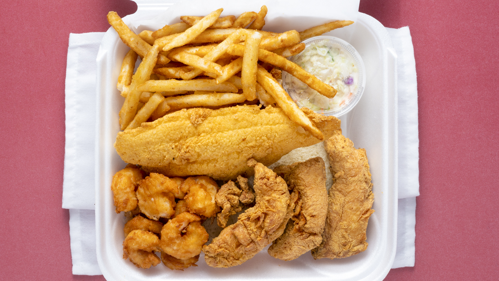 7. 3 Chicken Strips, 1 Pc. Catfish, 10 Shrimp with Fries and Drink