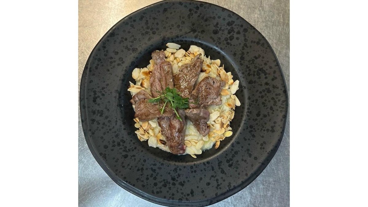 Risotto con Filetto di Manzo, Gorgonzola and Scaglie di Mandorle