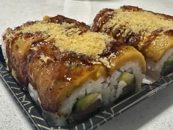 Angus Roll (Steak, Avocado, Cream Cheese, topped with Amarillo, Tempura Flakes)