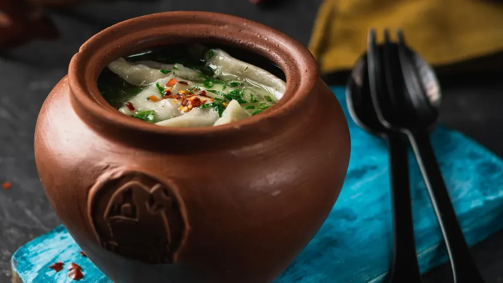 Meat pelmeni in chicken boulion