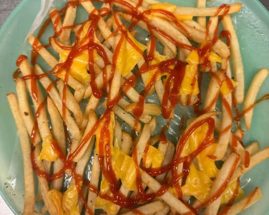 Loaded fries with (shredded chicken and cheese sauce)
