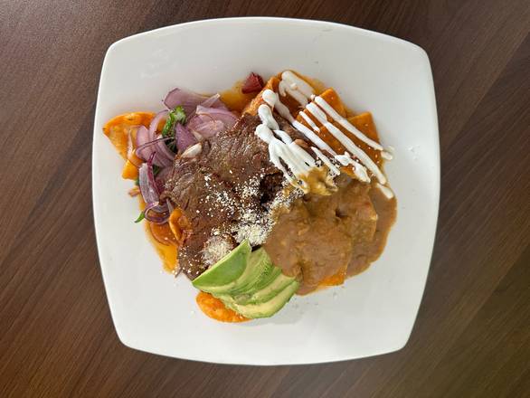 Chilaquiles con Carne (Chilaquiles with grilled beef)