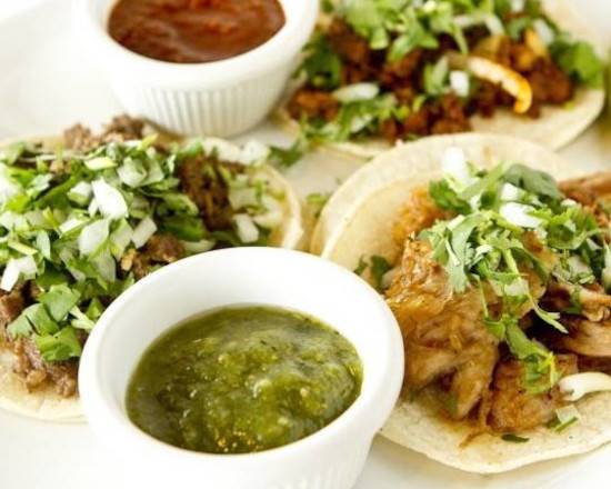 three Tacos /w/ Onions,cilantro,L,T,cheese,avocado