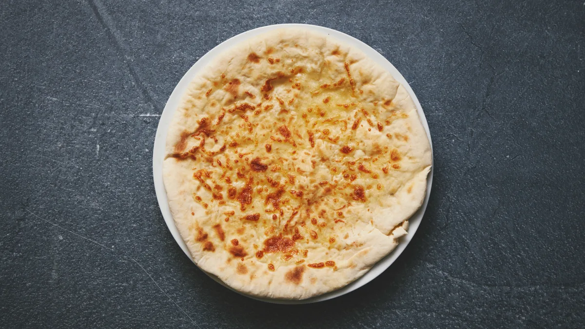 52. Cheese Naan (V)