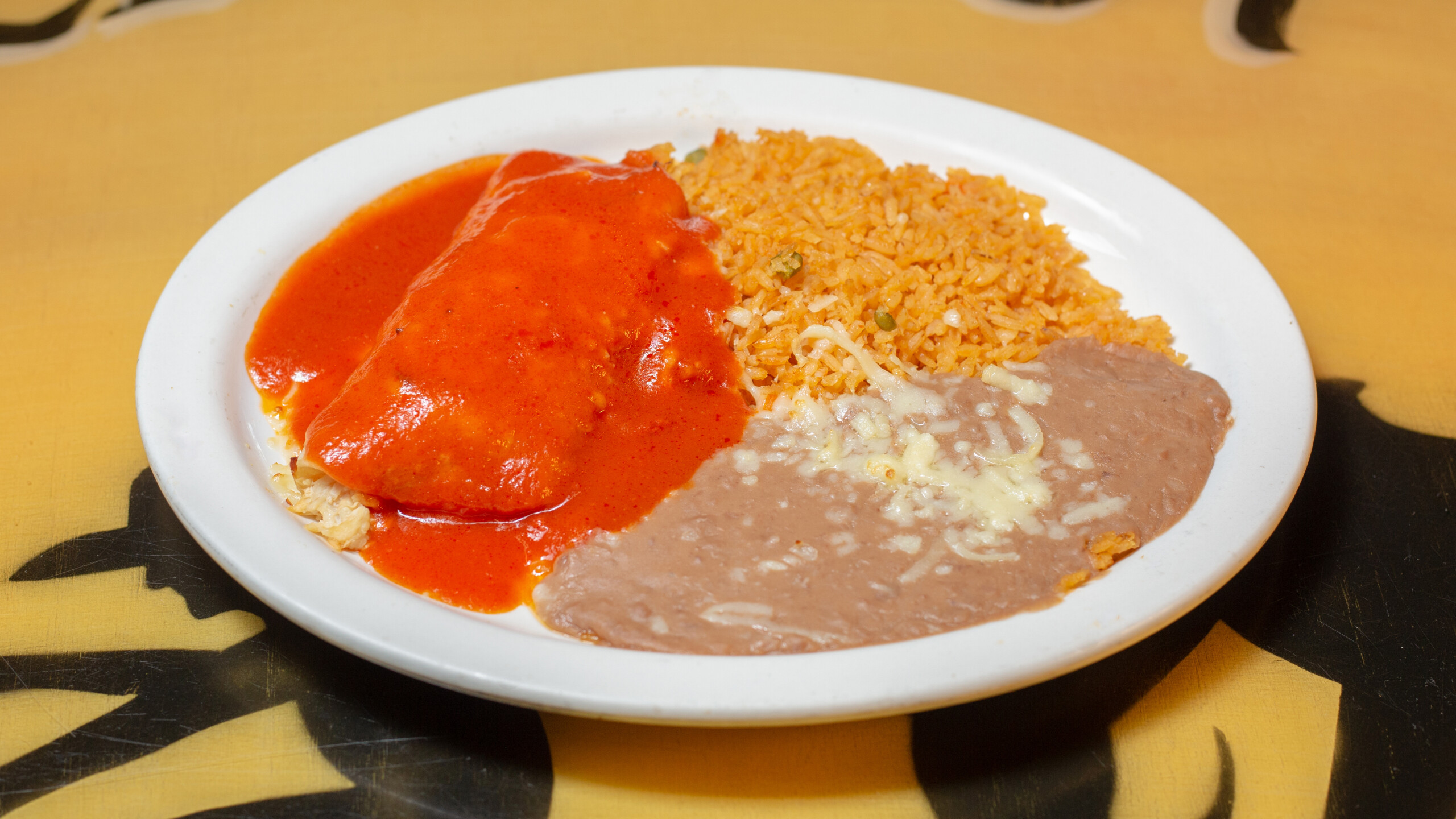 4. One Enchilada, Mexican Rice and Refried Beans