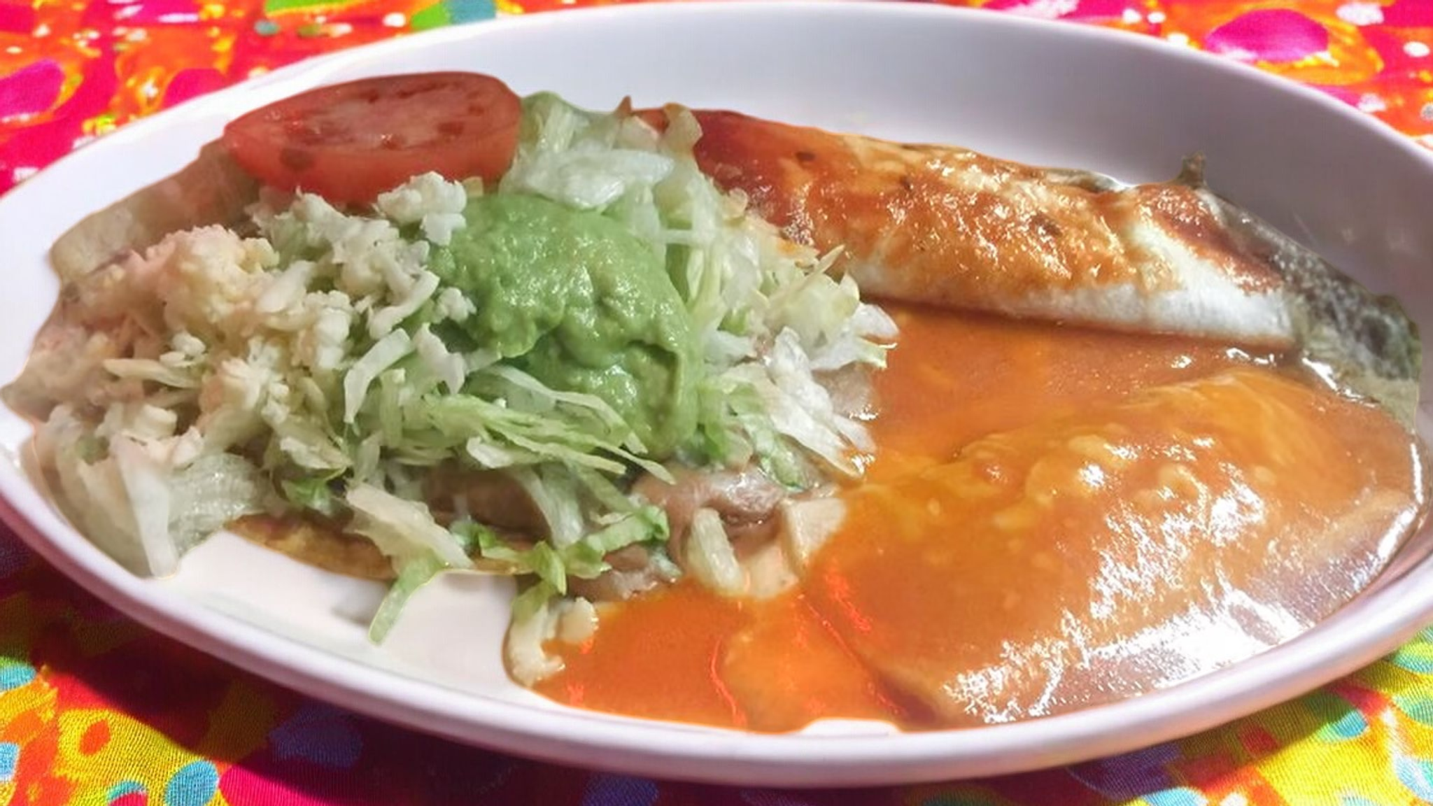 A). One Bean Burrito, One Cheese Enchilada and One Tostada Topped with Refried Beans and Cheddar Cheese