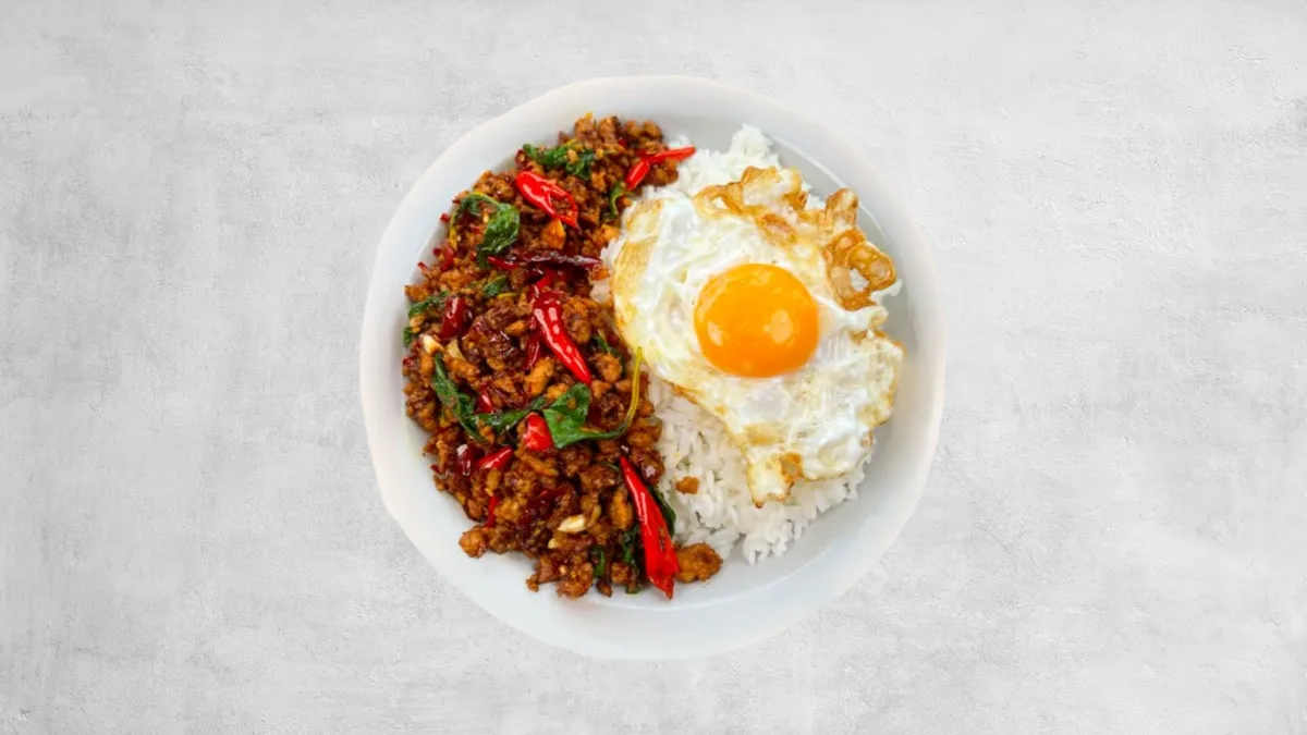 Pad Kha Pao with fried egg and rice