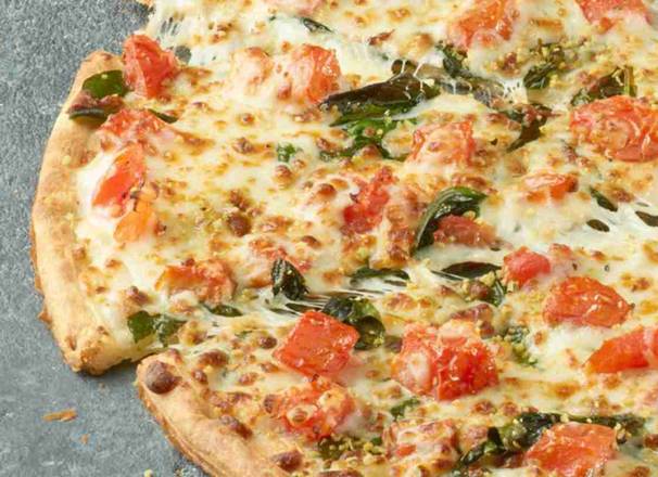 Fresh Spinach and Tomato Alfredo Pizza