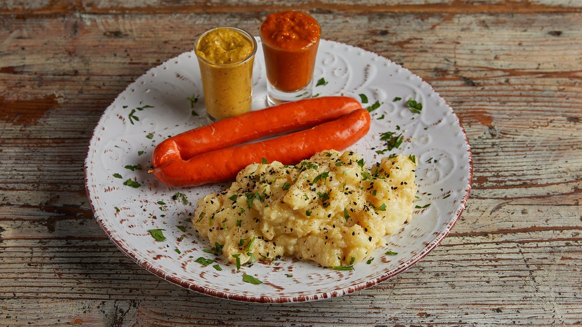 Depreziner mit Kartoffelsalat, Senf und Brot