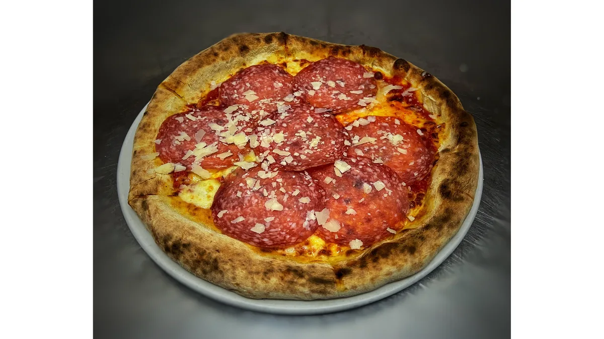 Pizza quattro formaggi and salam Milano