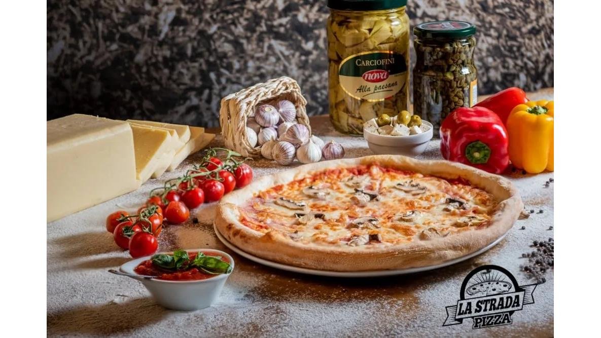 Pizza prosciutto funghi