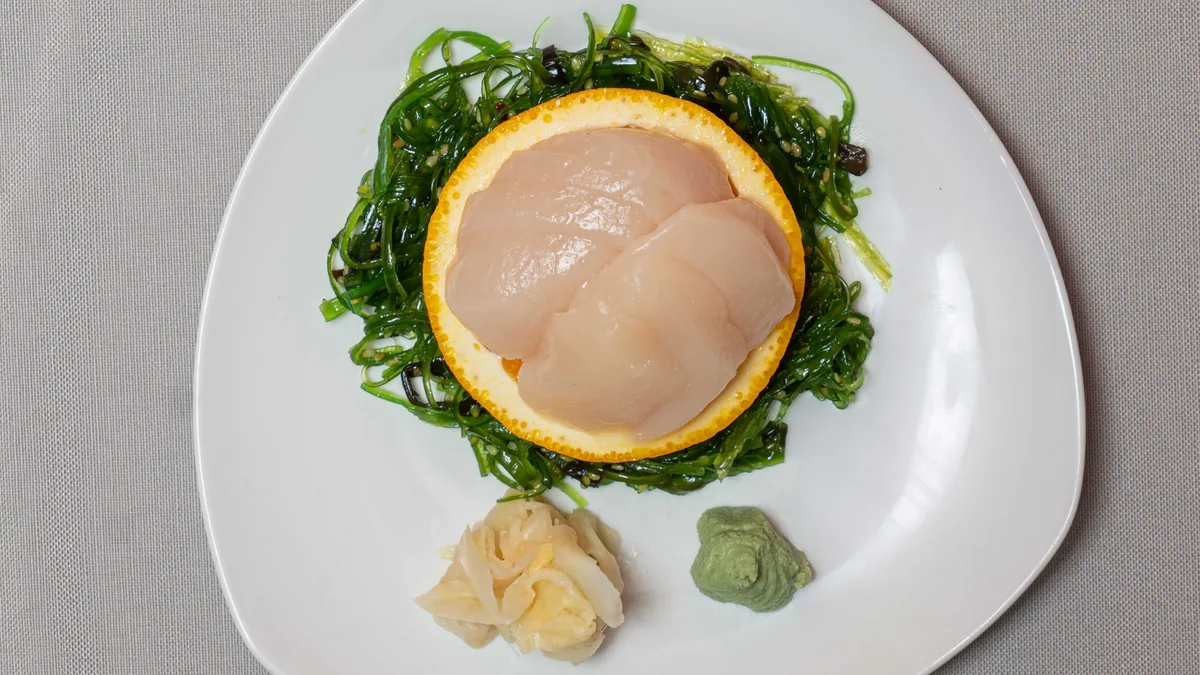 5 biter sashimi kamskjell