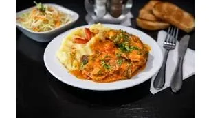 Pulpă de porc la tavă cu piure de cartofi