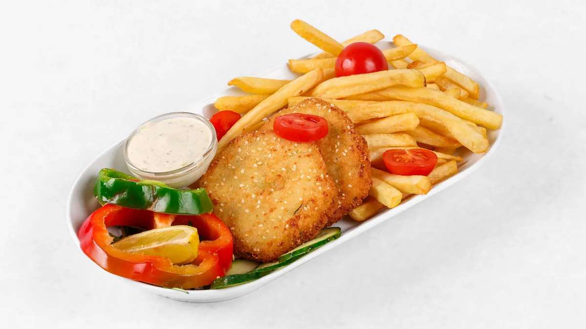 Cauliflower patty with cheese and fries