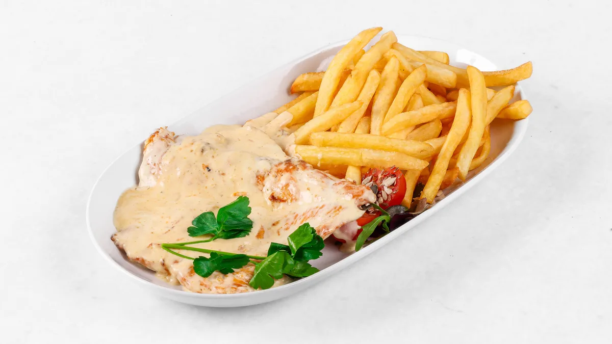 Turkey steak in cheese sauce