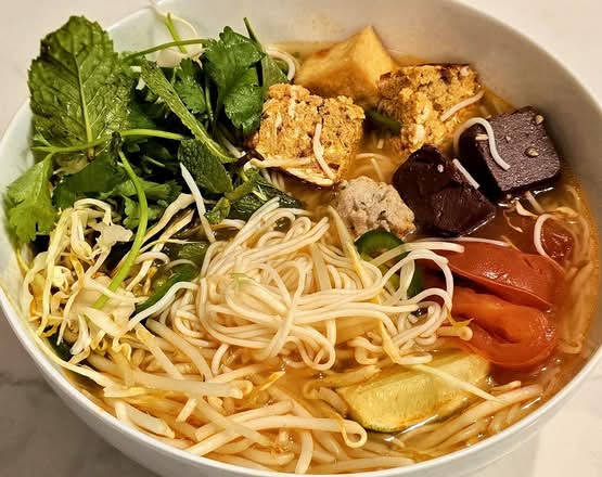48. Tomato Noodle Soup with Tofu, Pork Patty, Mince Shrimp, and Pork Blood (Bun Rieu)