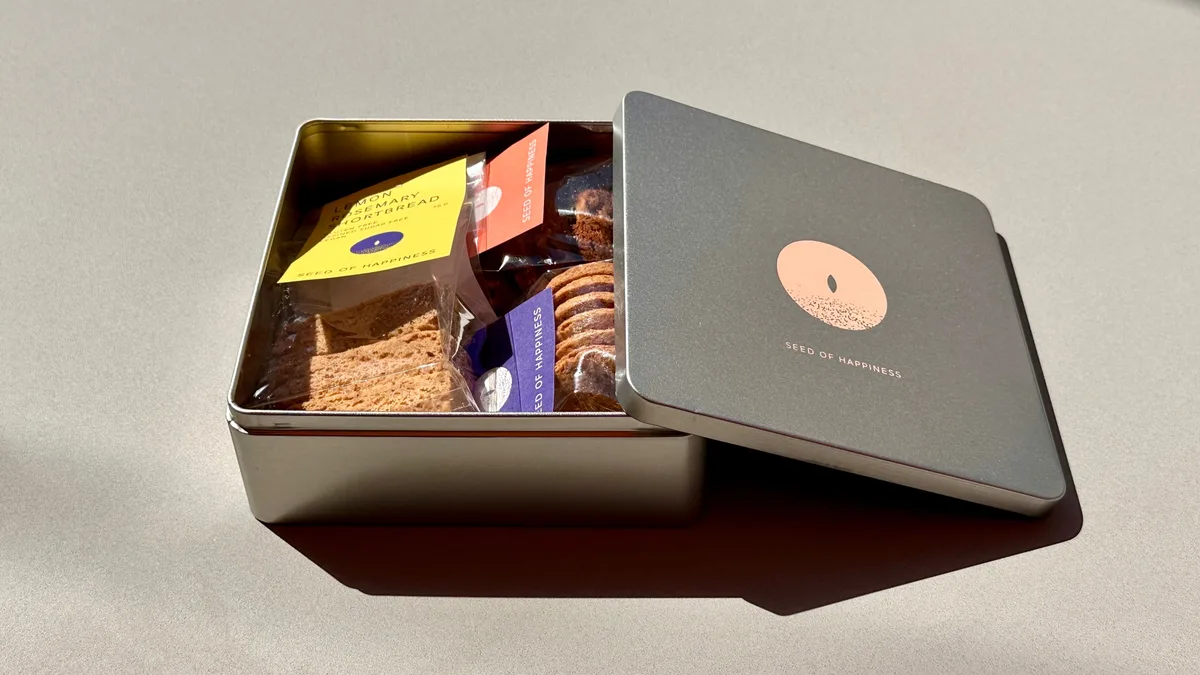 ASSORTED BISCUITS IN OUR SEED OF HAPPINESS TIN