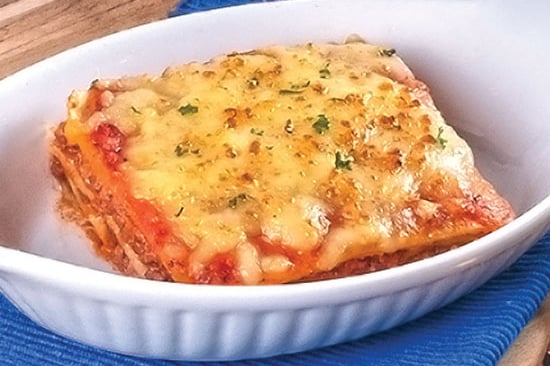 Lasagna Carne +tostadas +acompañamiento