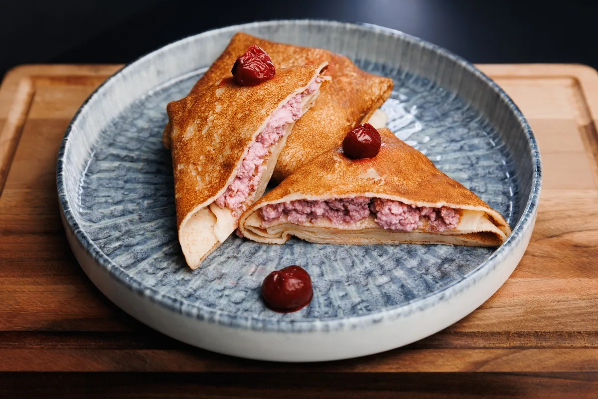 Pancakes with cherries and cottage cheese