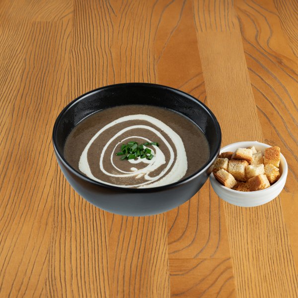 Cream soup with champignons and porcini mushrooms