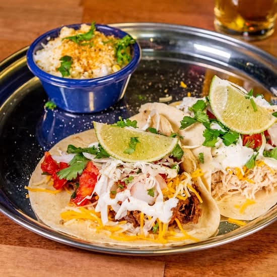 2 Gourmet Tacos with rice and refried beans